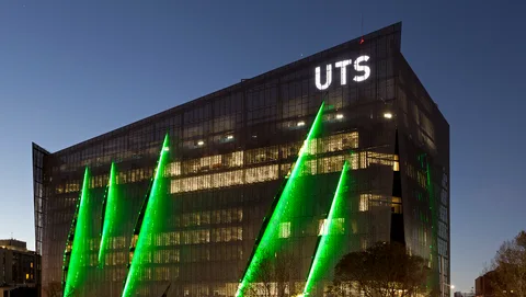 The UTS engineering and IT building illuminated at night.